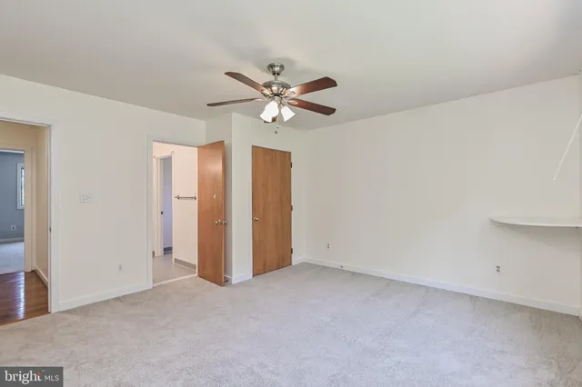 a view of a wooden deck with a big yard