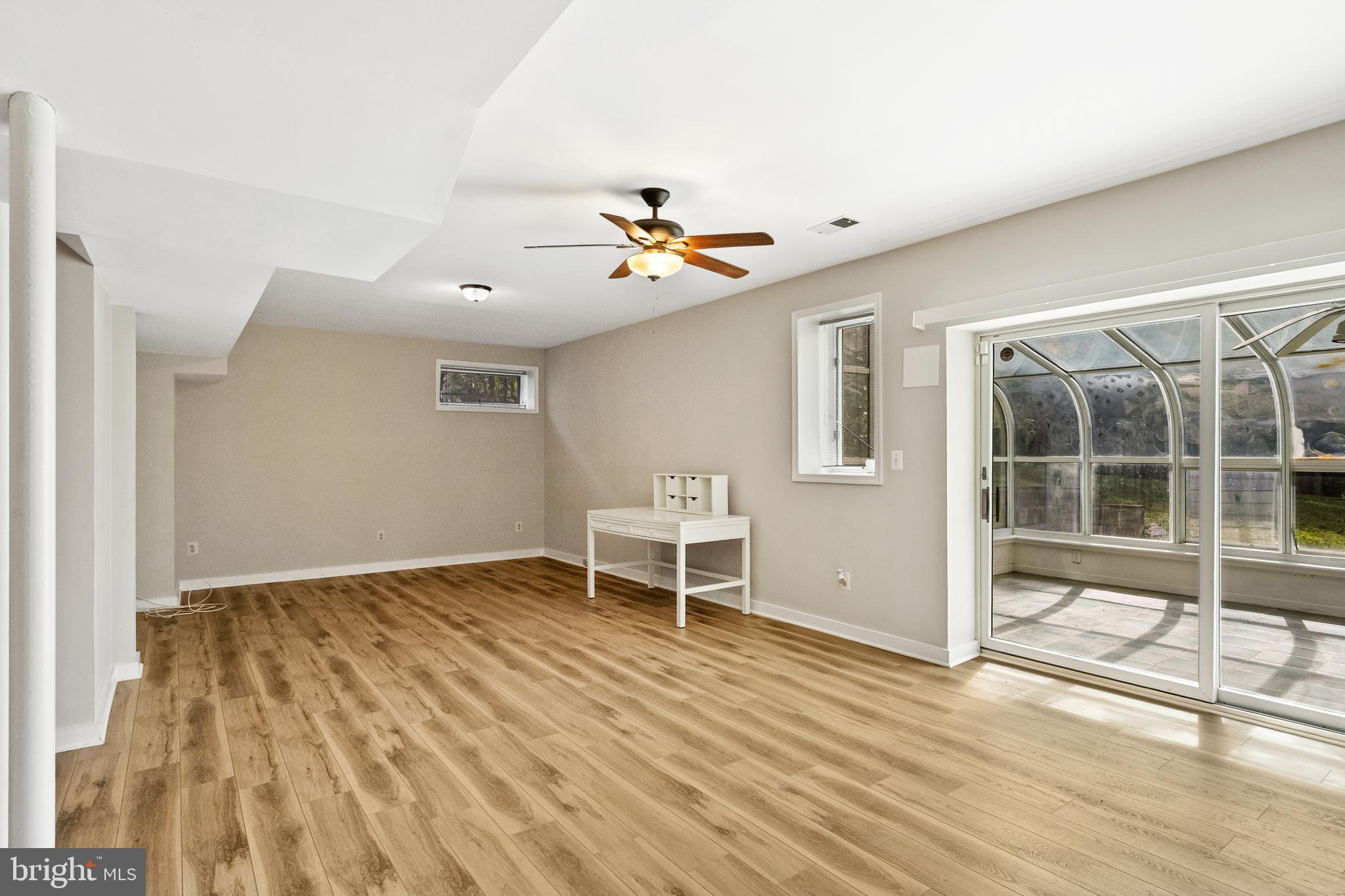 445 Springvale Road Great Falls, VA 22066 - Photo 42 of 62 Walkout Recreation Room with Sliding Glass Door