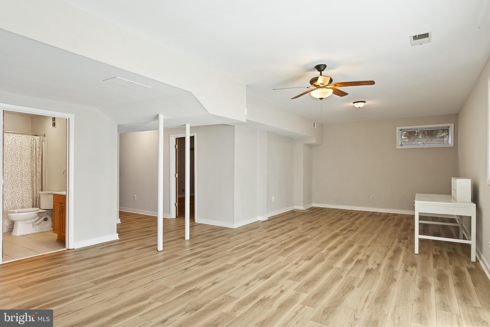 445 Springvale Road Great Falls, VA 22066 - Photo 43 of 62 a view of a livingroom with wooden floor and a fireplace