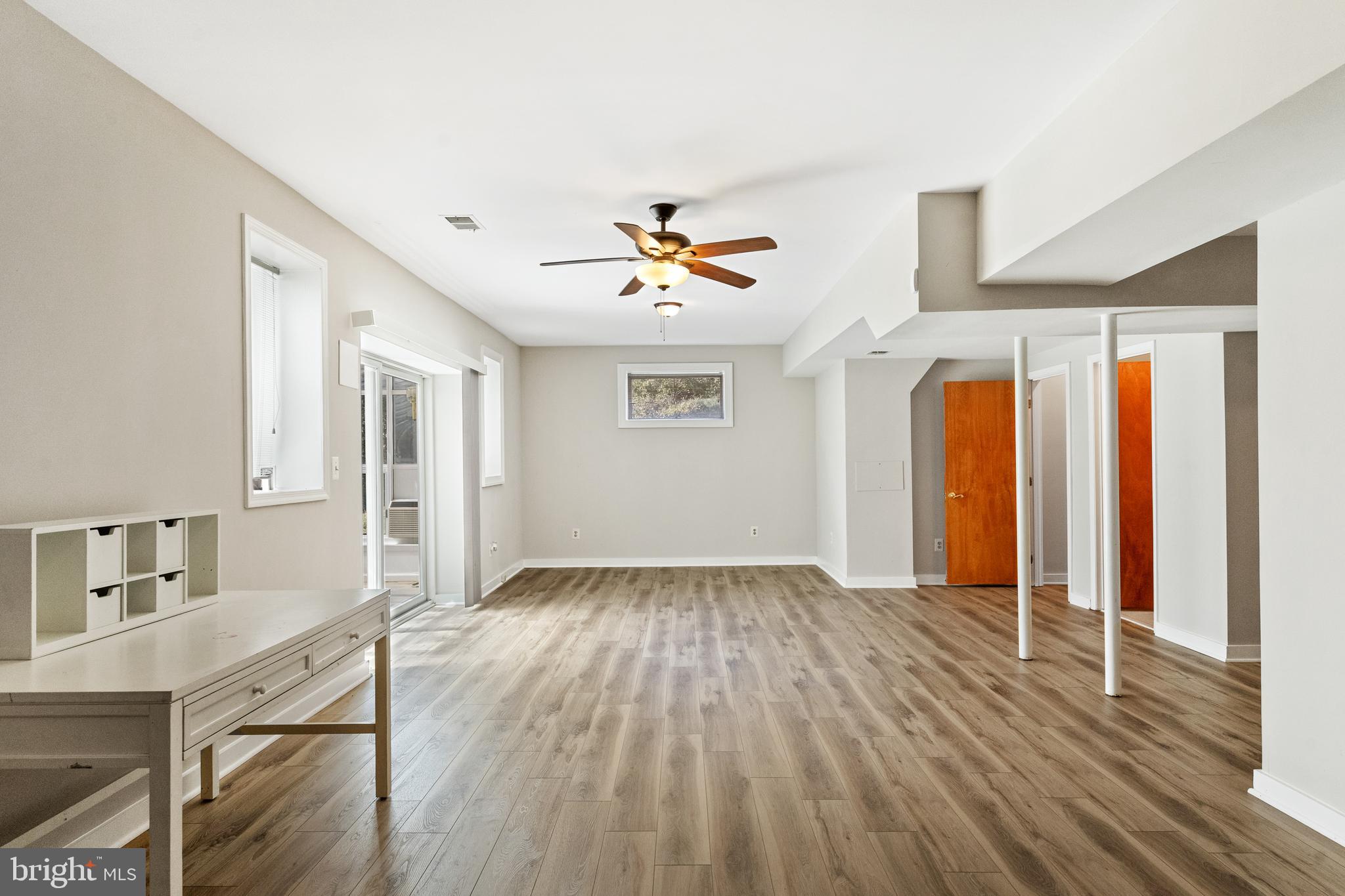 445 Springvale Road Great Falls, VA 22066 - Photo 44 of 62 a view of a room with wooden floor and a ceiling fan