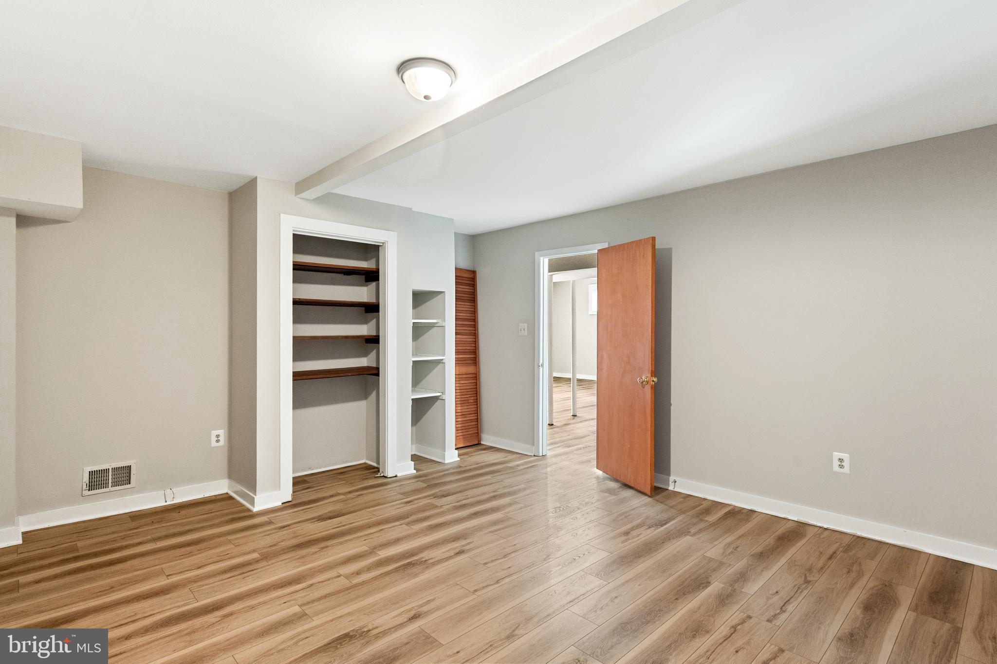 445 Springvale Road Great Falls, VA 22066 - Photo 46 of 62 a view of empty room with wooden floor and fan