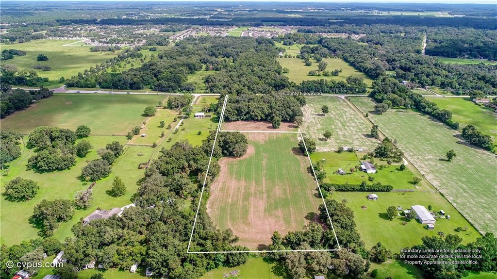 0 County Line (5 Acres) Rd Spring Hill Spring Hill, FL 34610 - Photo 1 of 1 an aerial view of a residential houses with outdoor space