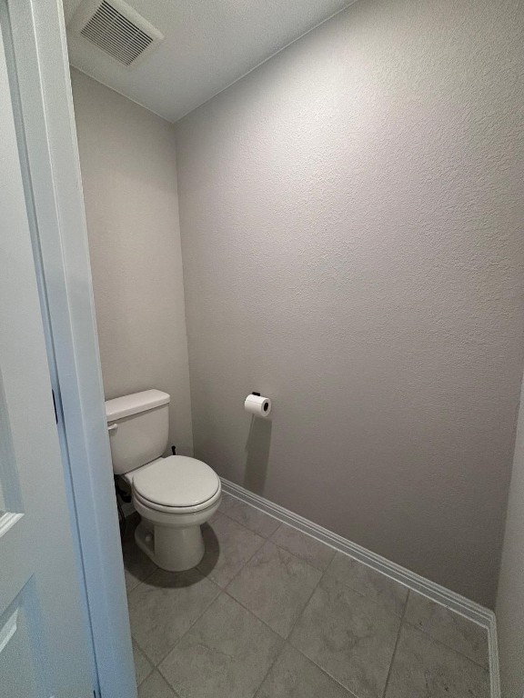 305 Harbors Lane Leander, TX 78641 - Photo 16 of 28 a bathroom with a toilet and a vanity