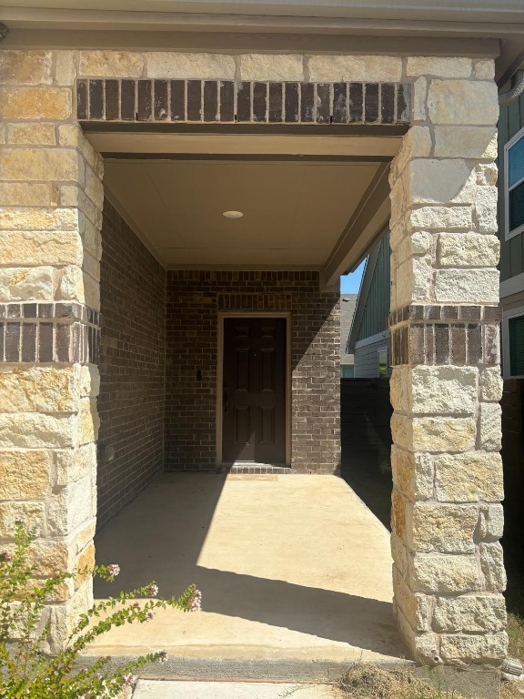 305 Harbors Lane Leander, TX 78641 - Photo 2 of 28 a balcony with table and chairs