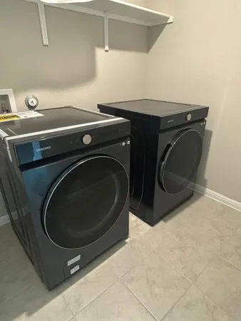 a utility room with dryer and washer