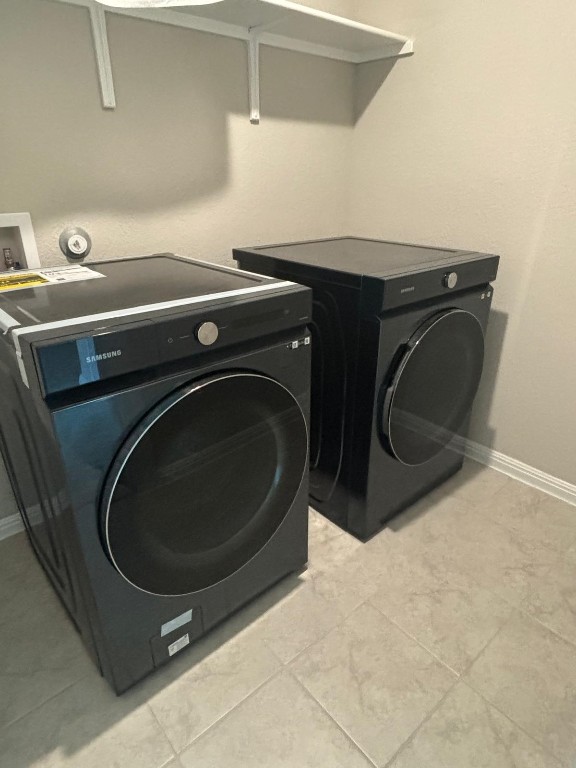 305 Harbors Lane Leander, TX 78641 - Photo 22 of 28 a utility room with dryer and washer