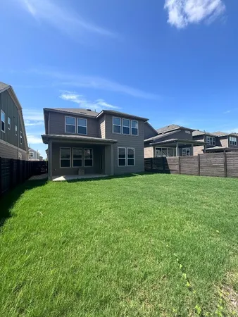 a view of a house with a back yard