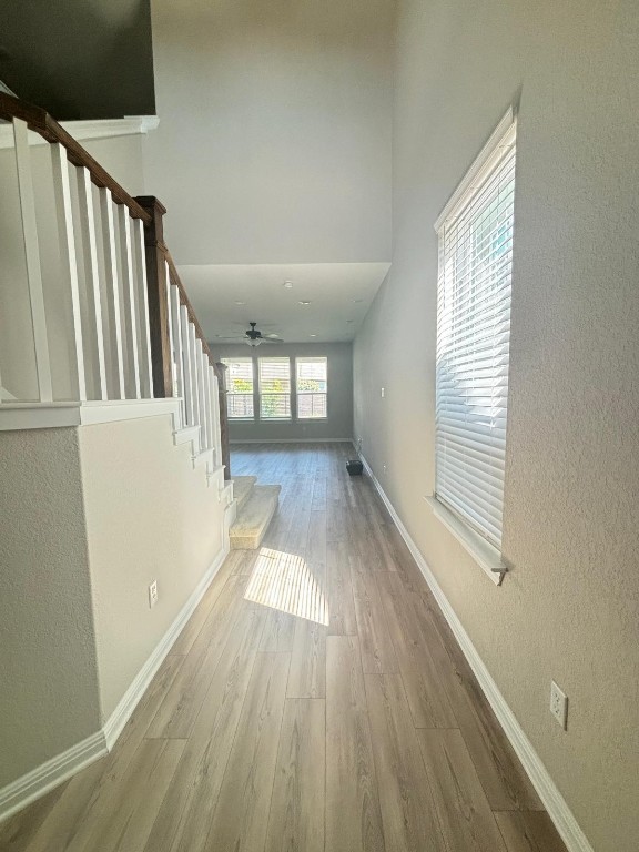 305 Harbors Lane Leander, TX 78641 - Photo 3 of 28 a view of an empty room with wooden floor and a window
