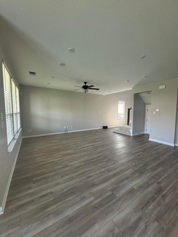 305 Harbors Lane Leander, TX 78641 - Photo 6 of 28 an empty room with wooden floor and windows