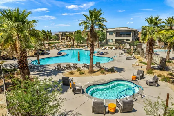 a view of a swimming pool with a patio