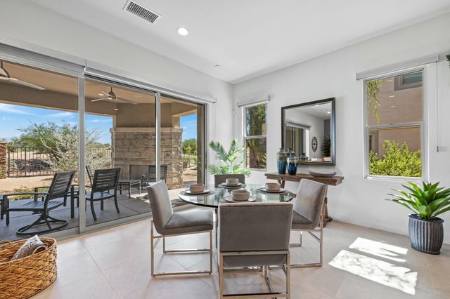 a view of a dining room with furniture wooden floor and flat screen tv