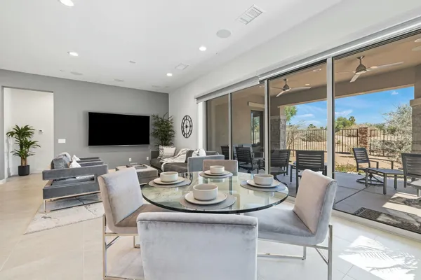a kitchen with a table and chairs in it