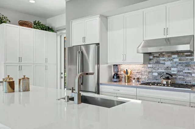 a kitchen with a sink and a window