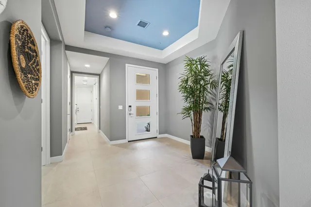 a view of a livingroom with furniture and a potted plant
