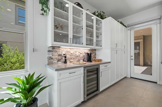 a view of a living room kitchen and a sink
