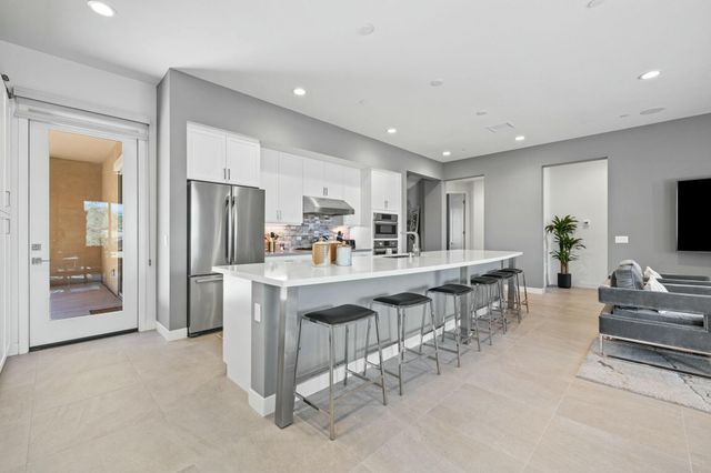 a bedroom with a bed couch and window