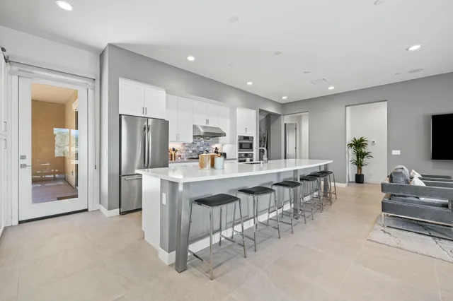 a bedroom with a bed couch and window