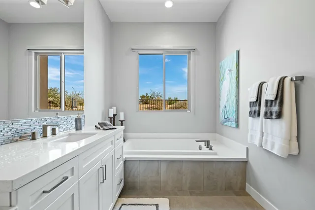a view of a livingroom with furniture and a flat screen tv