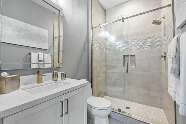 a view of a house with a snow on the road