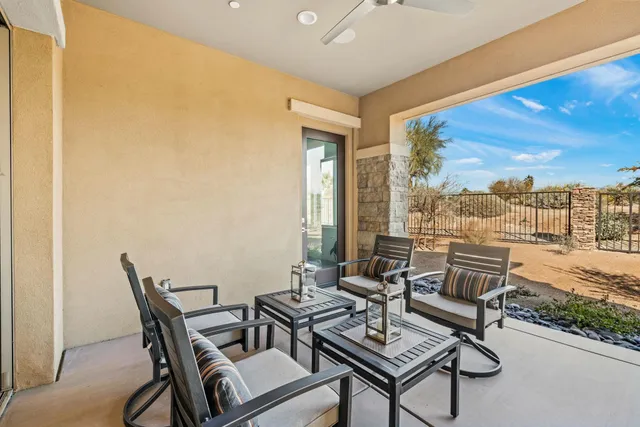 a view of swimming pool with outdoor seating
