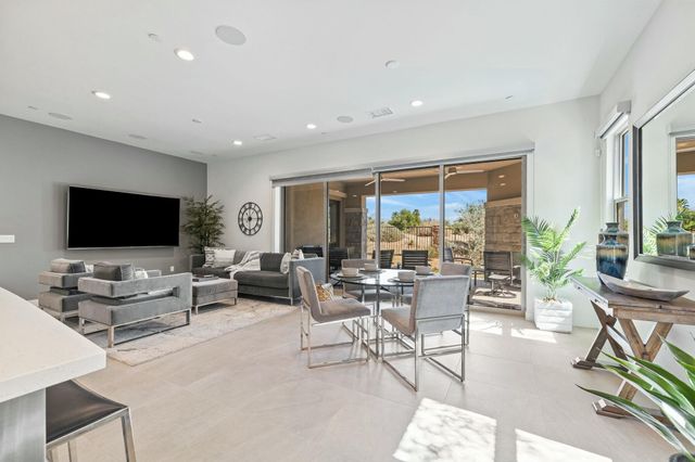 a view of a dining room with furniture window and outside view