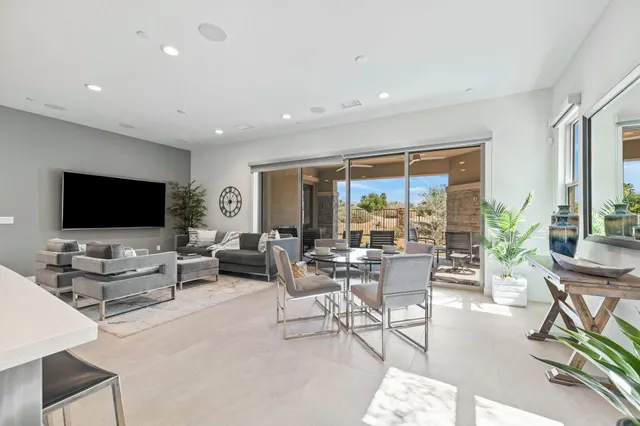 a view of a dining room with furniture window and outside view