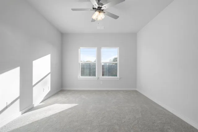 a kitchen with granite countertop white cabinets a sink and stainless steel appliances