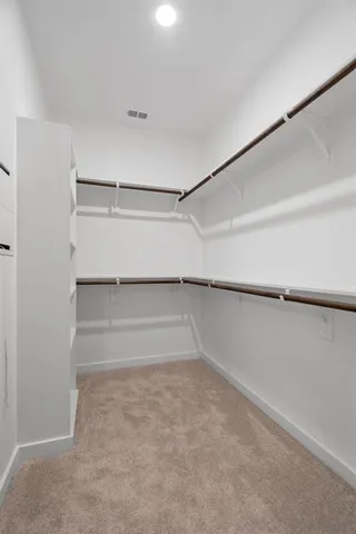 a bathroom with double sink and a mirror