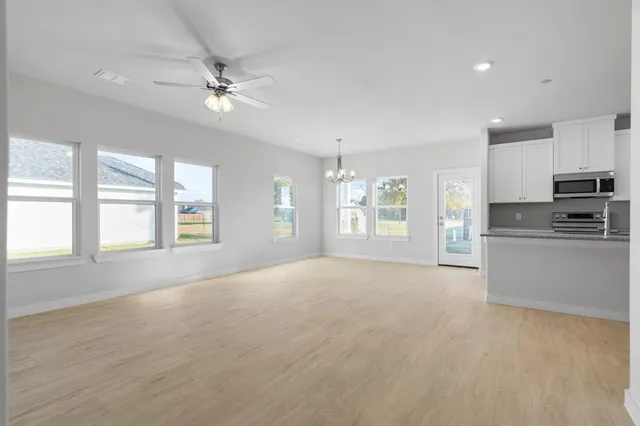 a view of an empty room with a window