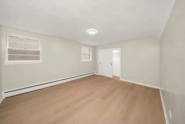 an empty room with a empty space and window