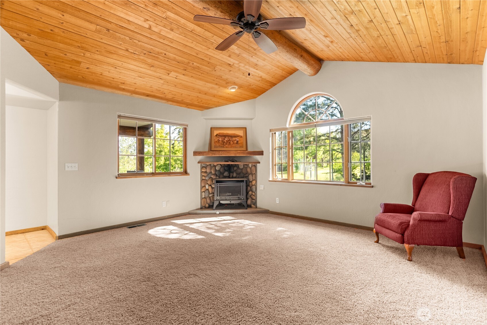 2621 Highway 153 Twisp, WA 98856 - Photo 11 of 40 a view of a livingroom with a window and a chair