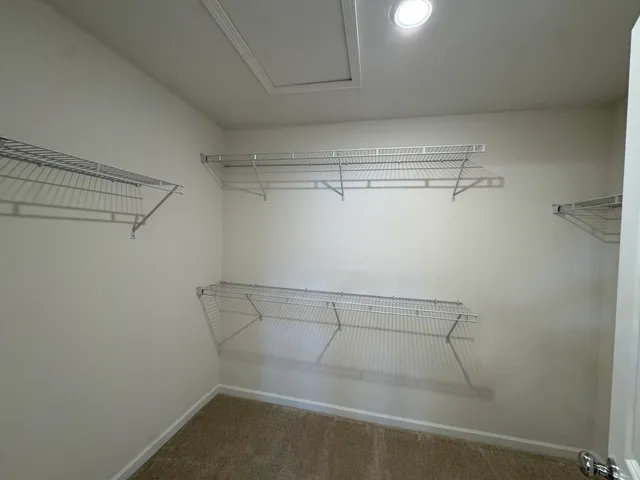 a view of a room with racks on the wall
