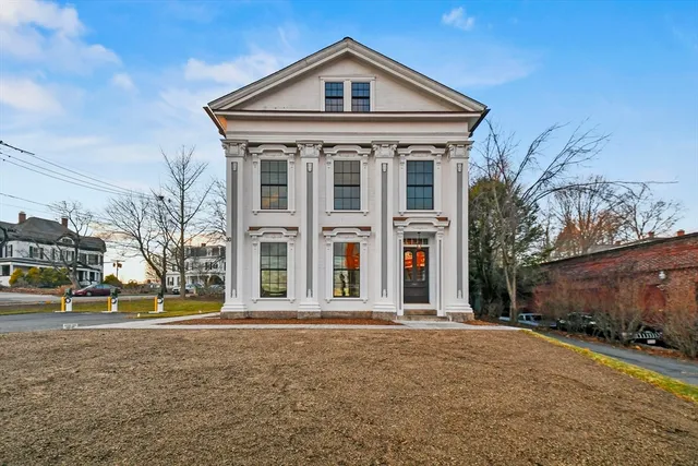 a front view of a house with a yard