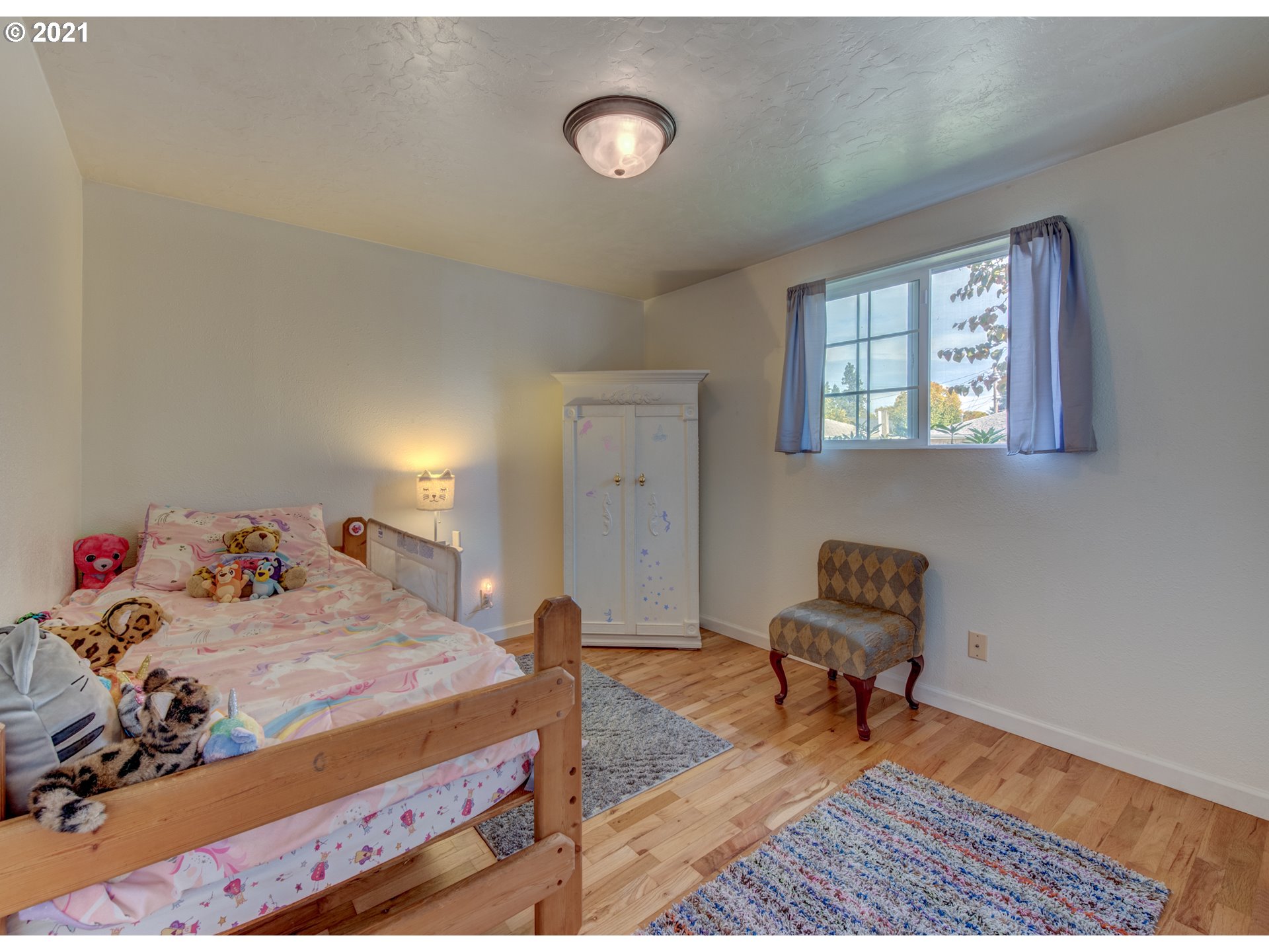 756 North 23rd Street Springfield, OR 97477 - Photo 11 of 22 a bedroom with a bed and a window