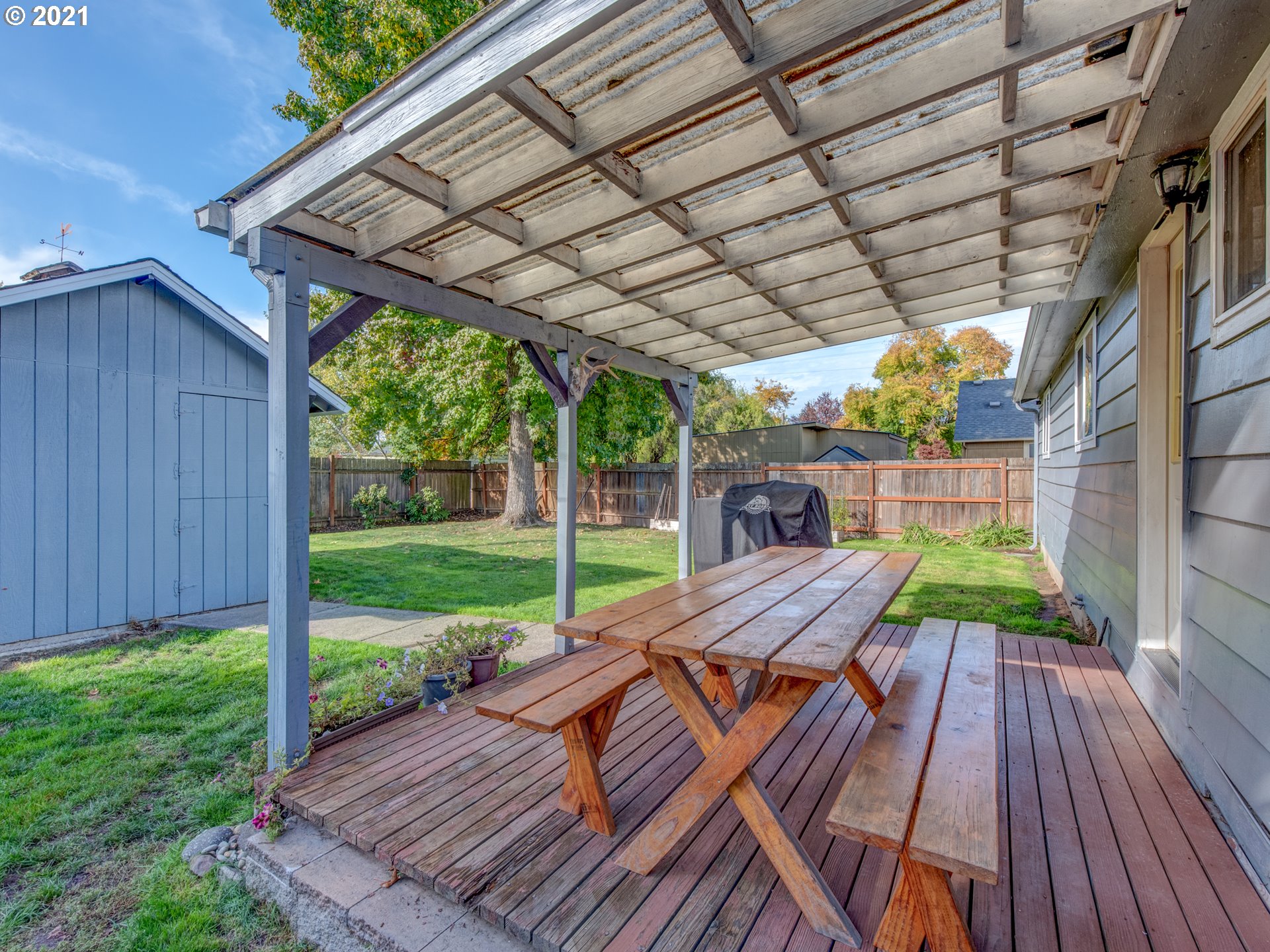 756 North 23rd Street Springfield, OR 97477 - Photo 21 of 22 a view of a wooden deck with a table and chairs