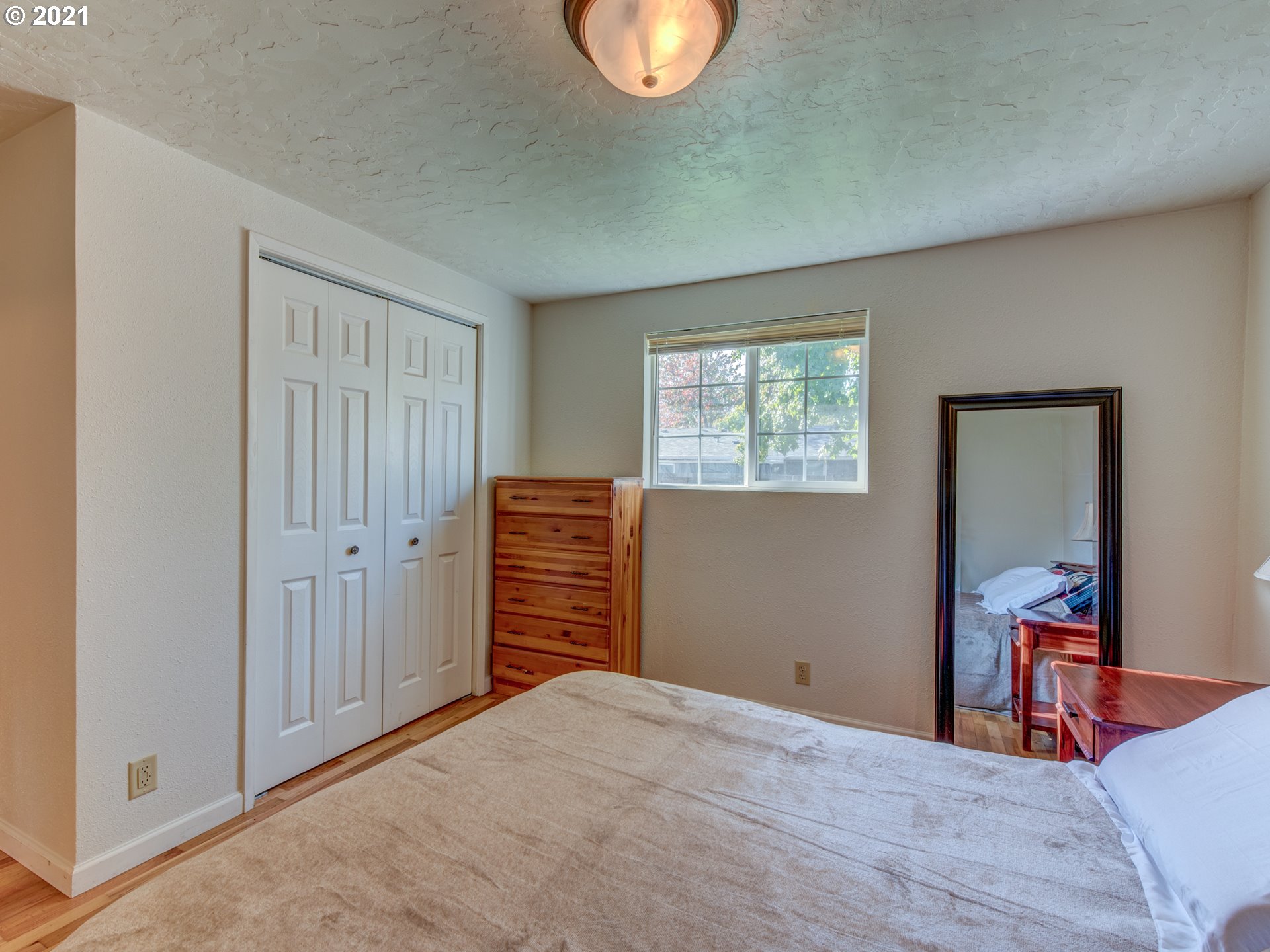 756 North 23rd Street Springfield, OR 97477 - Photo 9 of 22 an empty room with wooden floor closet and windows