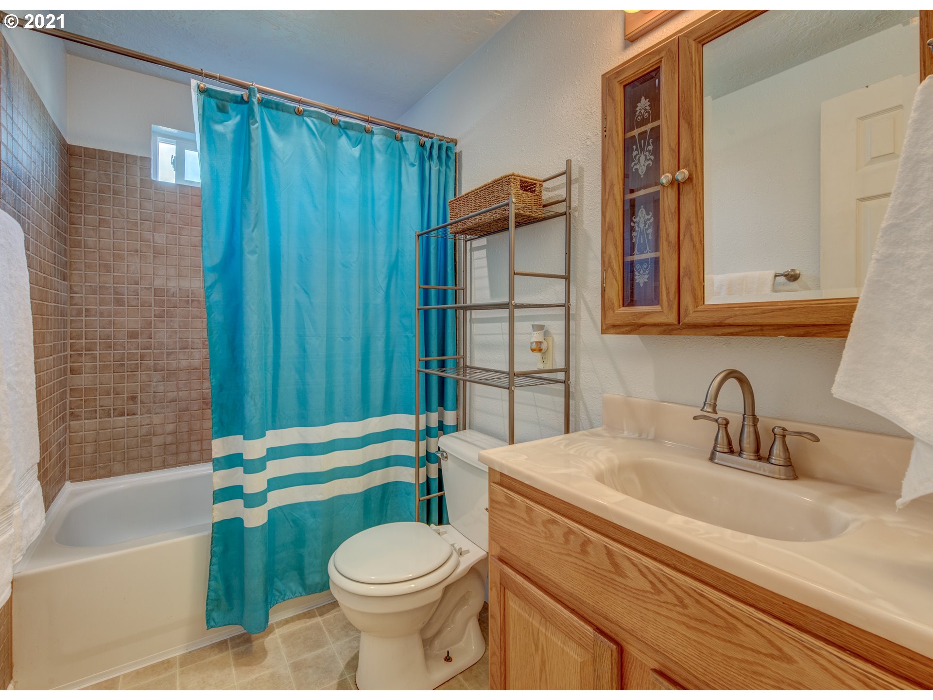756 North 23rd Street Springfield, OR 97477 - Photo 10 of 22 a bathroom with a sink a toilet and shower