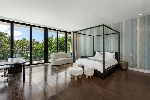 a view of a living room and floor to ceiling window