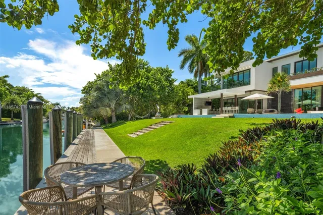 a front view of a house with a yard table and chairs