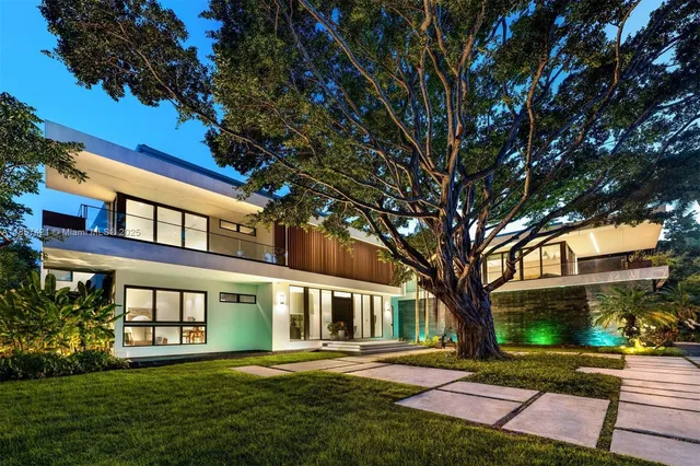 a view of a living room with pool table and sofas