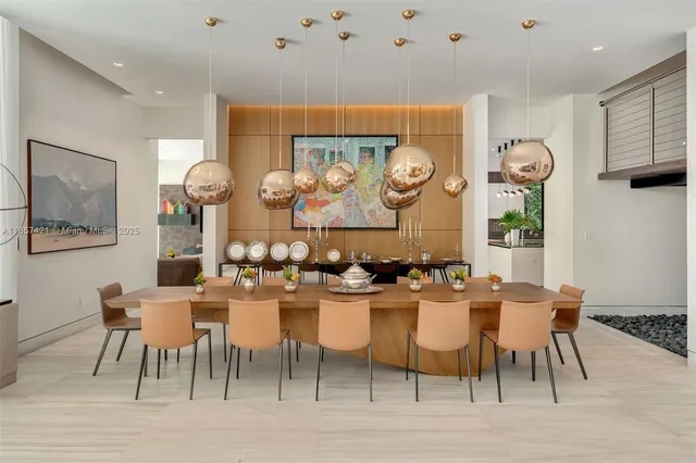 a kitchen with stainless steel appliances granite countertop white cabinets and a refrigerator