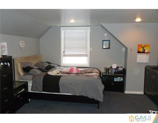 161 East Hill Road Colonia, NJ 07067 - Photo 12 of 16 a bedroom with a bed and window