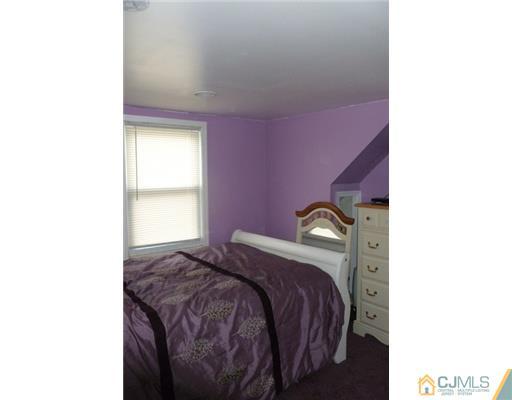 161 East Hill Road Colonia, NJ 07067 - Photo 13 of 16 a bedroom with a bed and a window