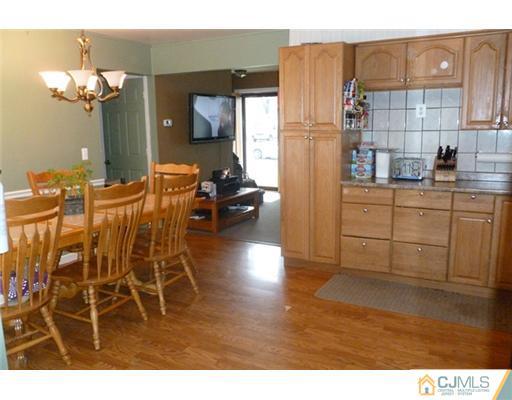 161 East Hill Road Colonia, NJ 07067 - Photo 7 of 16 a kitchen with stainless steel appliances granite countertop a refrigerator and microwave