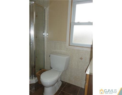 161 East Hill Road Colonia, NJ 07067 - Photo 10 of 16 a white toilet sitting next to a bathroom sink