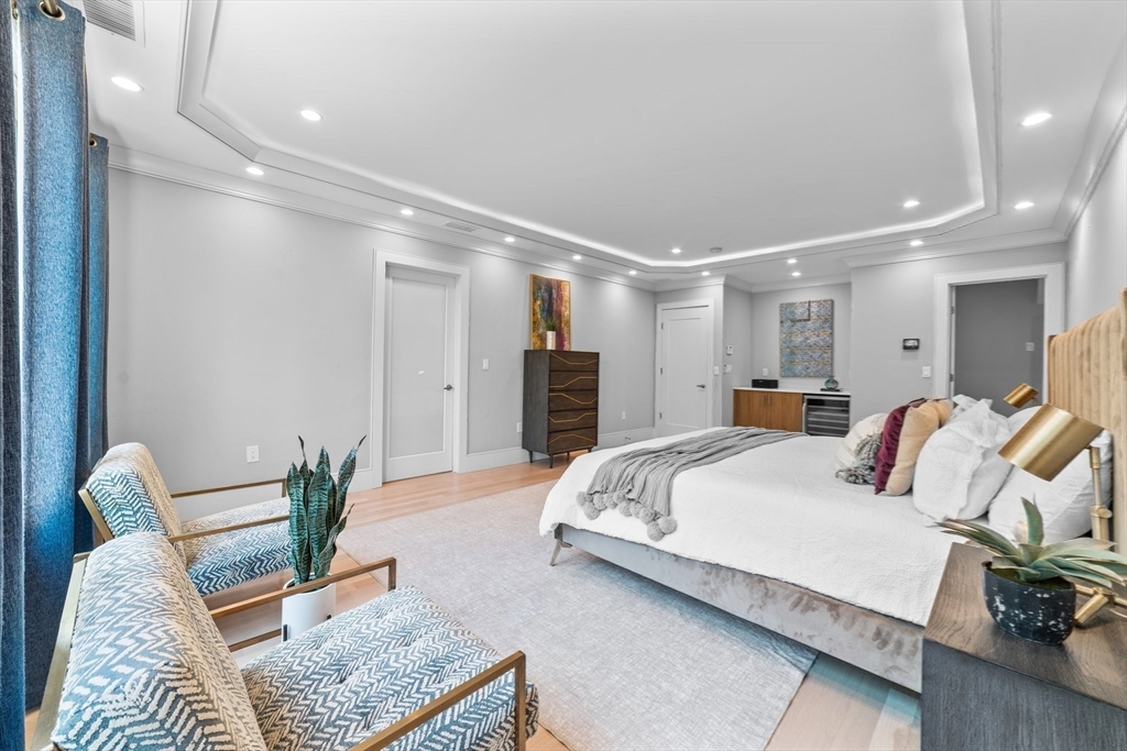 19 Boulder Road Newton, MA 02459 - Photo 16 of 42 a bedroom with a bed and furniture