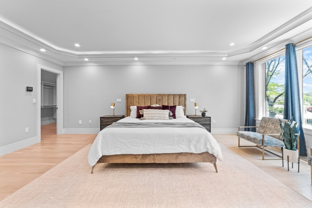 19 Boulder Road Newton, MA 02459 - Photo 17 of 42 a bedroom with a bed and large windows