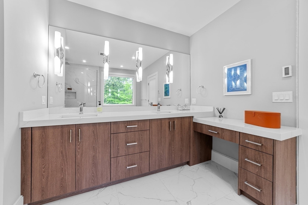 19 Boulder Road Newton, MA 02459 - Photo 19 of 42 a bathroom with a sink vanity and mirror