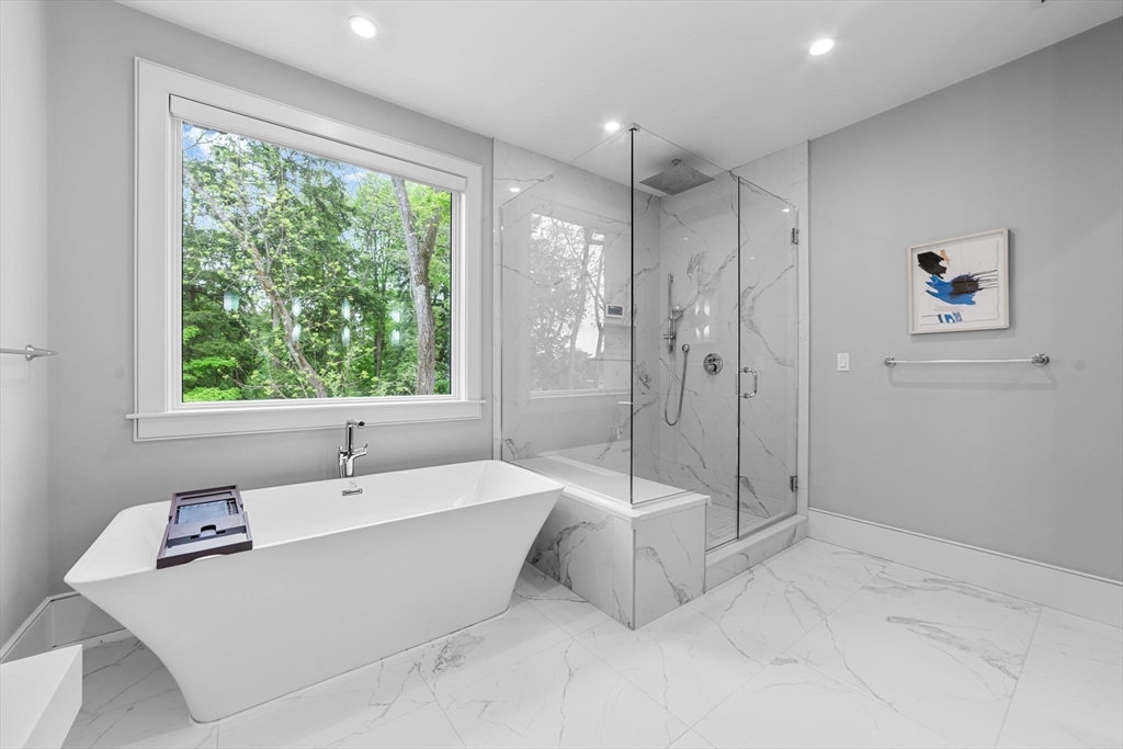 19 Boulder Road Newton, MA 02459 - Photo 20 of 42 a bathroom with a tub a sink and shower