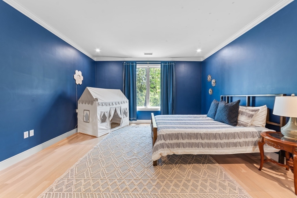 19 Boulder Road Newton, MA 02459 - Photo 24 of 42 a spacious bedroom with a bed and a window